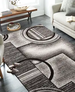 Moderní koberce Originální šedohnědý koberec s motivem abstraktních kruhů Šířka: 160 cm | Délka: 220 cm