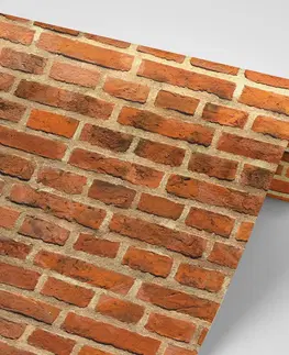 Tapety s imitací cihly, kamene a betonu Fototapeta oranžová cihlová zeď