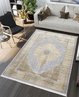 Moderní koberce Exkluzivní moderní šedý koberec se zlatým orientálním vzorem Šířka: 80 cm | Délka: 150 cm