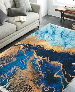 Moderní koberce Protišmykový koberec v modrej farbe s abstraktným vzorom