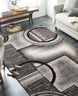 Moderní koberce Originální šedohnědý koberec s motivem abstraktních kruhů