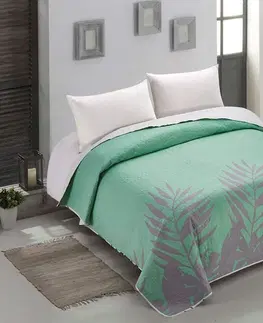 Luxusní oboustranné přehozy na postel Prošívaný oboustranný přehoz na postel s tropickým motivem