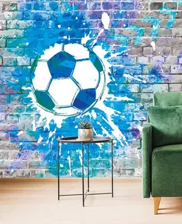 Samolepící tapety Samolepící tapeta modrý fotbalový míč na cihlové zdi