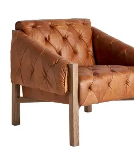 Luxusní a designová křesla a fotely Estila Kožené vintage křeslo Robel s hnědým prošívaným čalouněním a dřevěnýma nohama 75cm