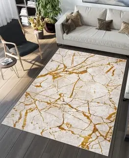 Moderní koberce Nadčasový koberec do obývacího pokoje se zlatým motivem