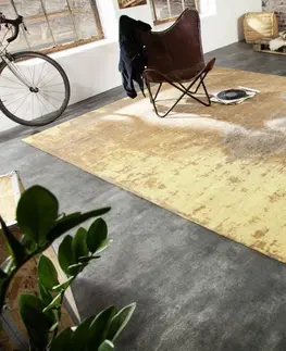 Designové a luxusní koberce Estila Orientální vkusný koberec Adassil žluté barvy s industriálním nádechem 350cm