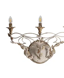 Designové nástěnné lampy Estila Rustikální nástěnná lampa Cerebea II s kovovou konstrukcí s vintage patinou a florálním zdobením 40cm