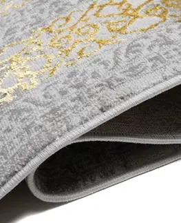 Moderní koberce Exkluzivní šedý koberec se zlatým orientálním vzorem