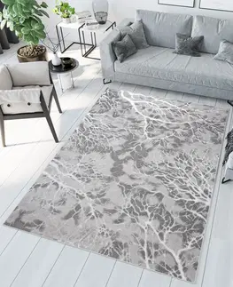 Moderní koberce Jednoduchý moderní koberec v šedé barvě s bílým motivem