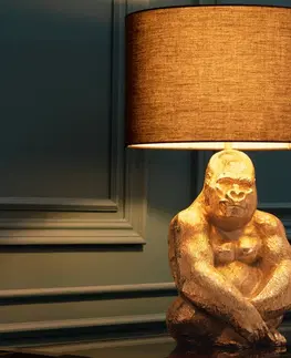 Luxusní a designové stolní lampy Estila Designová stolní lampa Apell s kovovou podstavou ve zlaté barvě ve tvaru gorily as kruhovým černým stínítkem 60 cm