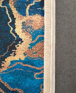 Moderní koberce Protišmykový koberec v modrej farbe s abstraktným vzorom