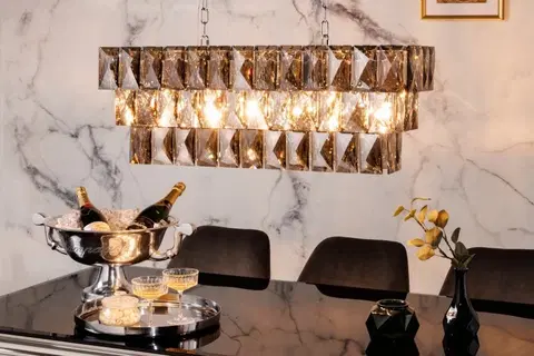 Luxusní designové závěsné lampy Estila Luxusní závěsná lampa Leontin z kovu a křišťálu stříbrné barvy 127cm