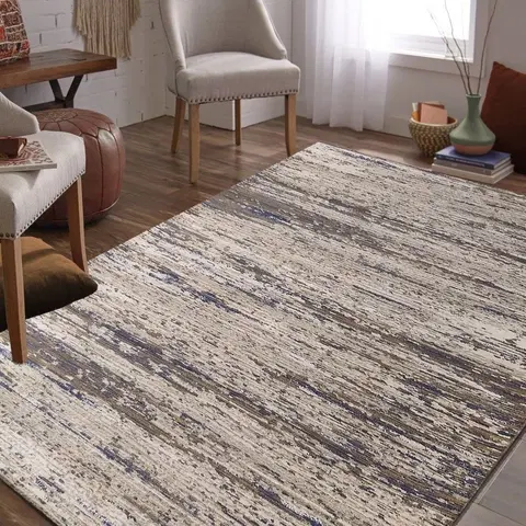 Moderní koberce Moderní koberec v béžovo-hnědé barvě s modrým detailem